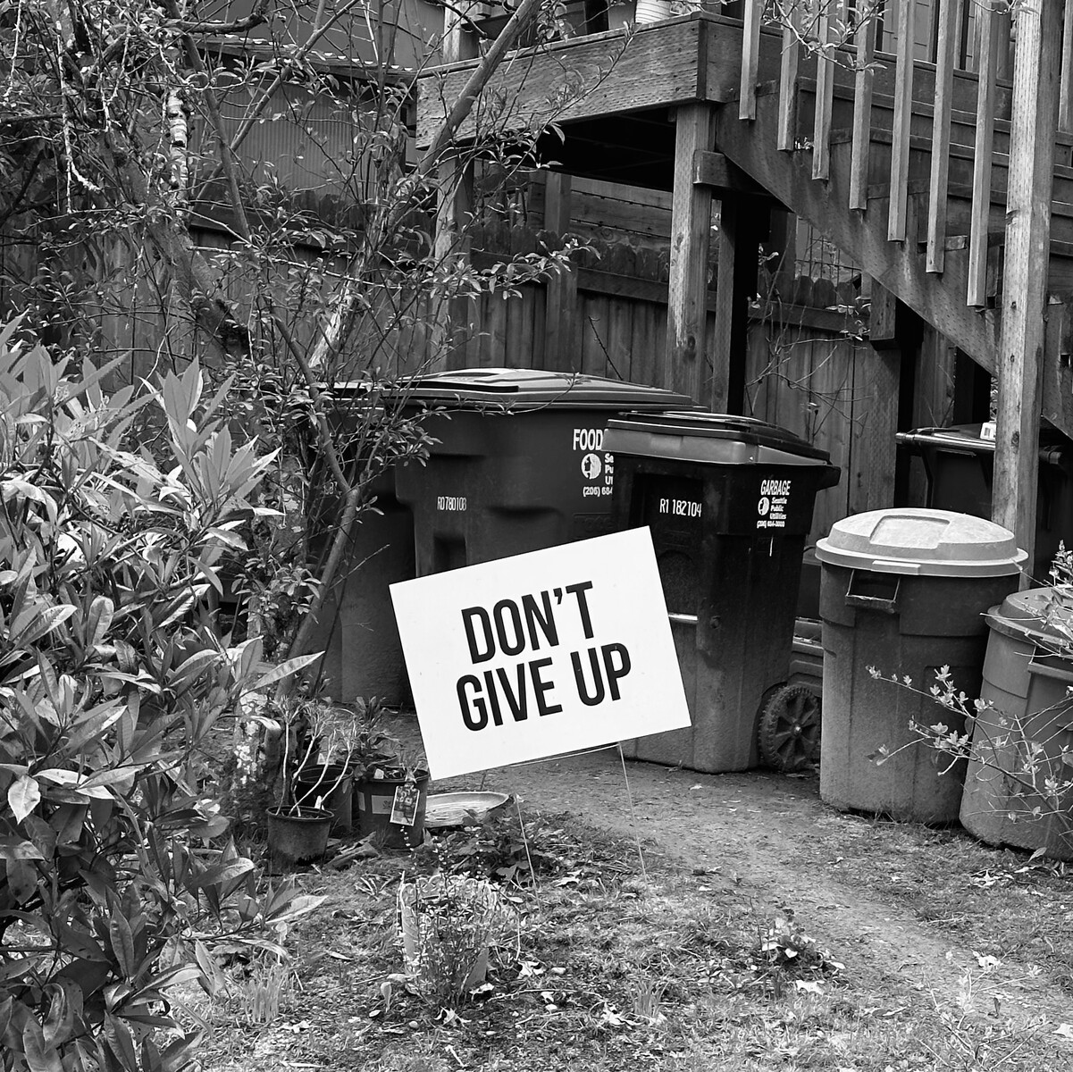 Yard sign that reads ‘Don't give up’